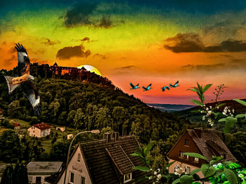 Panoramic view of townscape against sky during sunset