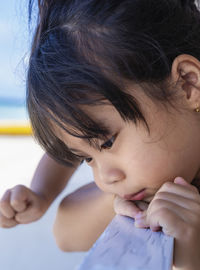 Close-up of girl looking away