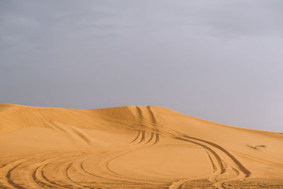 Scenic view of desert against sky