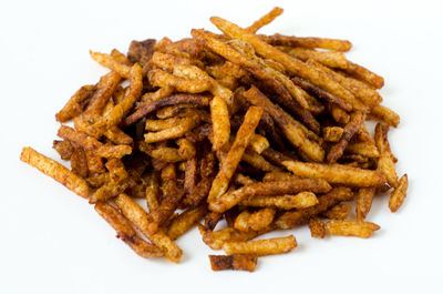 Close-up of burger against white background