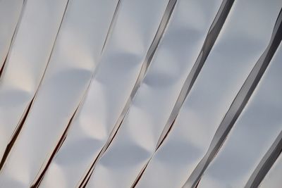 Low angle view of metallic structure against sky