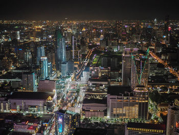 High angle view of illuminated buildings in city at night