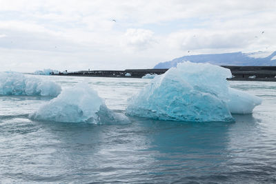 Scenic view of frozen sea against sky