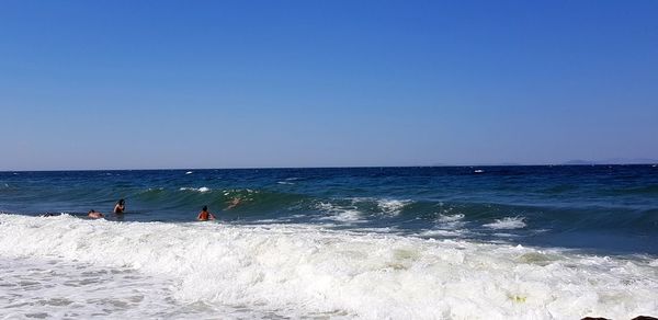 Scenic view of sea against clear blue sky