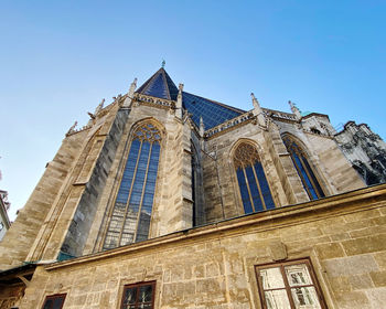 Low angle view of historic cathedral against sky