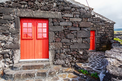 Red door of stone building