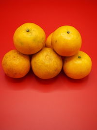 Close-up of oranges against orange background