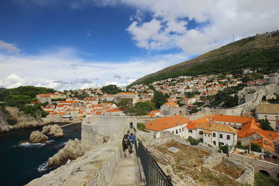 Scenic view of town against sky