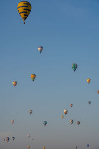 Low angle view of hot air balloons against sky