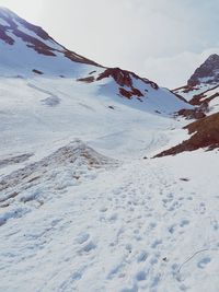 Snow covered mountain against sky