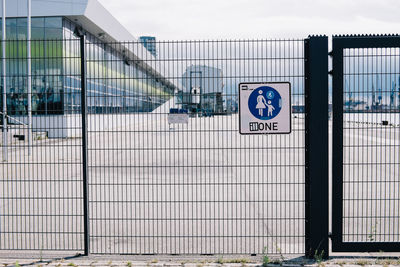 Sign on metallic fence