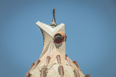 Low angle view of traditional building against clear blue sky