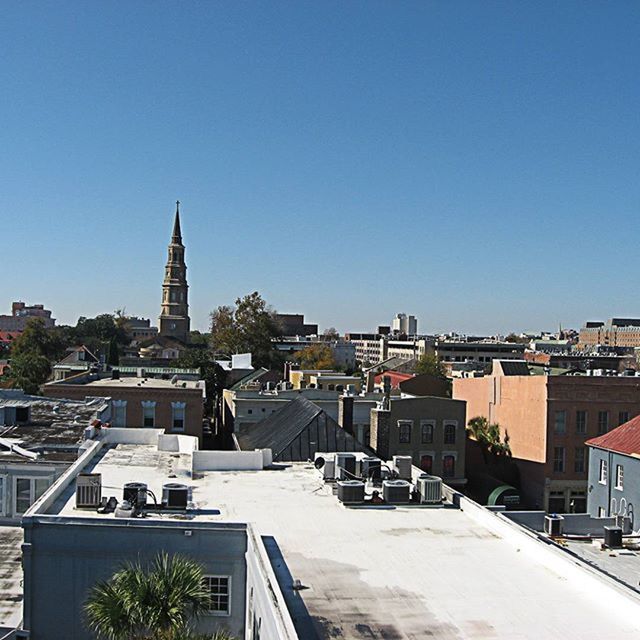 building exterior, architecture, built structure, clear sky, copy space, blue, residential structure, residential district, residential building, city, house, high angle view, cityscape, town, crowded, roof, townscape, city life, sunlight, day