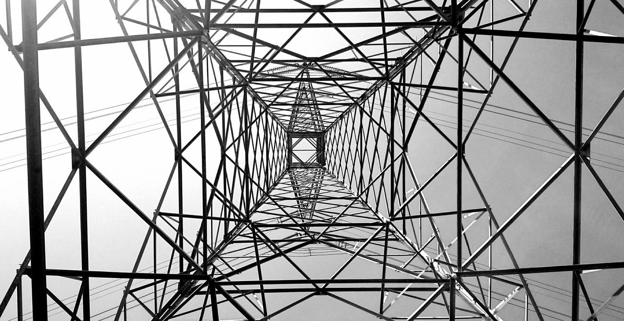 low angle view, electricity pylon, power line, electricity, connection, power supply, metal, fuel and power generation, sky, built structure, directly below, grid, technology, complexity, backgrounds, silhouette, pattern, full frame, metallic, architecture