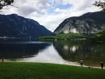 Scenic view of lake and mountains against sky