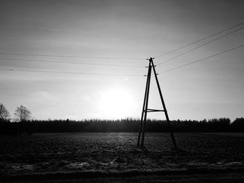 Scenic view of field against sky during winter