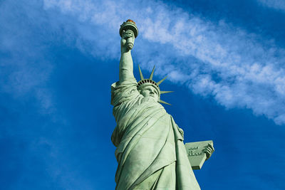 Low angle view of statue of liberty against sky