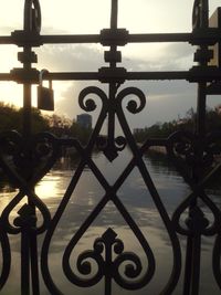 Metal gate against sky