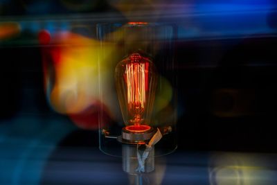 Close-up of illuminated light bulb