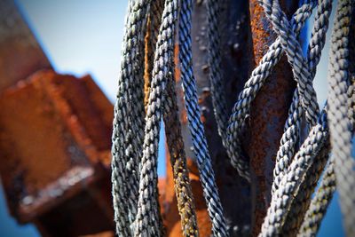 Close-up of rope tied on rusty metal