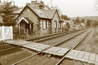 Railroad track with houses in background