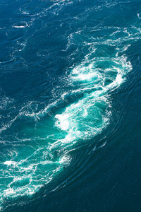 High angle view of spiral sea waves
