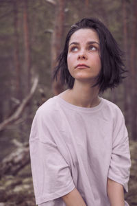 Portrait of a beautiful young woman looking away