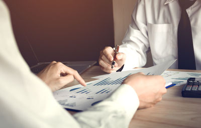 Businessmen working at desk in office