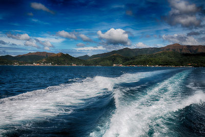 Scenic view of sea against blue sky