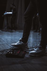 Low section of man standing on floor