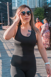 Portrait of young woman wearing sunglasses