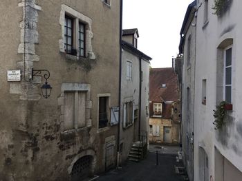 Narrow alley amidst buildings in city