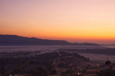 Sunrise and morning light behind mountains with mist covered at khao takhian ngo phetchabun,thailand