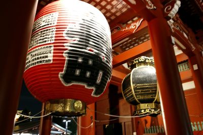 Low angle view of illuminated lantern hanging at night