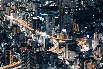 Aerial view of city lit up at night