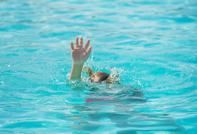 Young woman swimming in pool