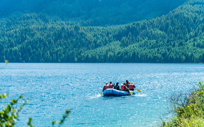 People kayaking in sea