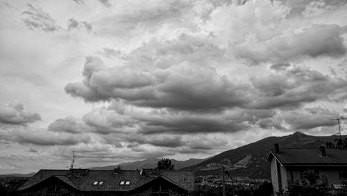 Low angle view of building against cloudy sky