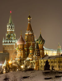 Illuminated cathedral against sky during winter at night