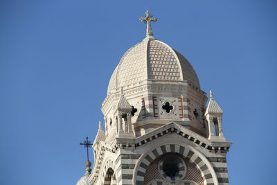 Low angle view of church against blue sky