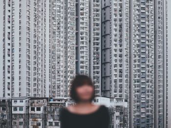 Exterior of buildings with woman in foreground