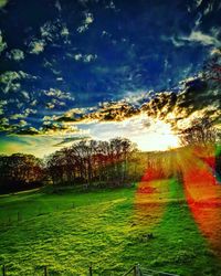 Scenic view of field against sky during sunset