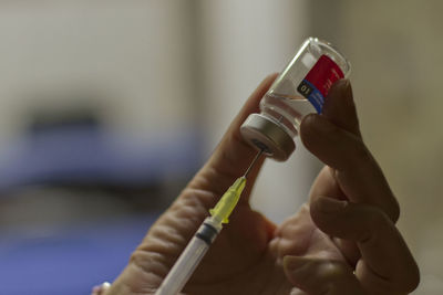 Close-up of hand holding camera