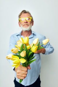 Portrait of woman holding flower