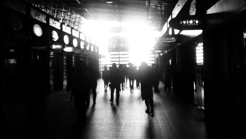 People walking in illuminated city