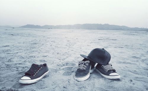 High angle view of shoes over water against white background