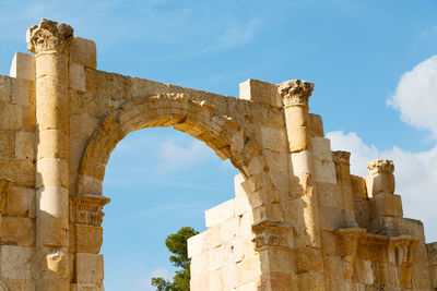 Low angle view of old ruin building against sky