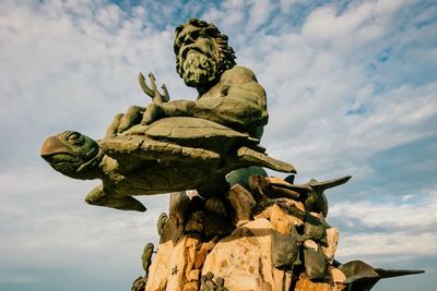 Low angle view of statue against sky