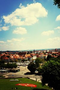Buildings against cloudy sky