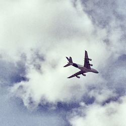 Low angle view of airplane flying in sky